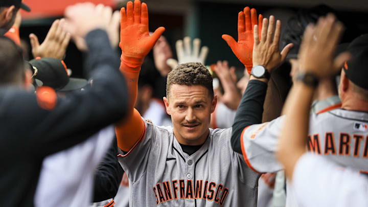 Mar 30, 2025; Cincinnati, Ohio, USA; San Francisco Giants third baseman Matt Chapman (26) high fives teammates after hitting a two-run home run in the sixth inning against the Cincinnati Reds at Great American Ball Park. Mar 30, 2025; Cincinnati, Ohio, USA; San Francisco Giants third baseman Matt Chapman (26) high fives teammates after hitting a two-run home run in the sixth inning against the Cincinnati Reds at Great American Ball Park.