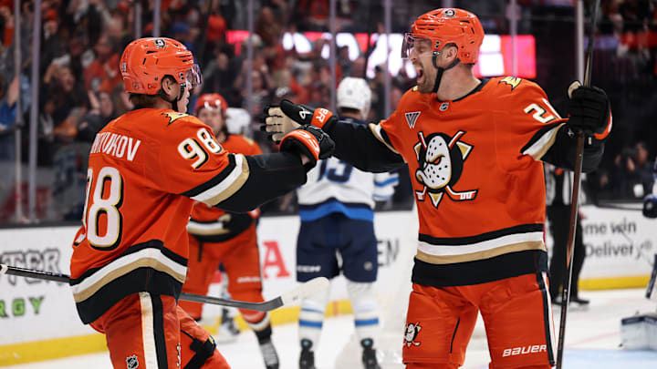 Feb 27, 2026; Anaheim, California, USA;  Anaheim Ducks defenseman Pavel Mintyukov (98) celebrates with left wing Jeffrey Viel (28) after scoring a goal during the third period against the Winnipeg Jets at Honda Center. Mandatory Credit: Kiyoshi Mio-Imagn Images