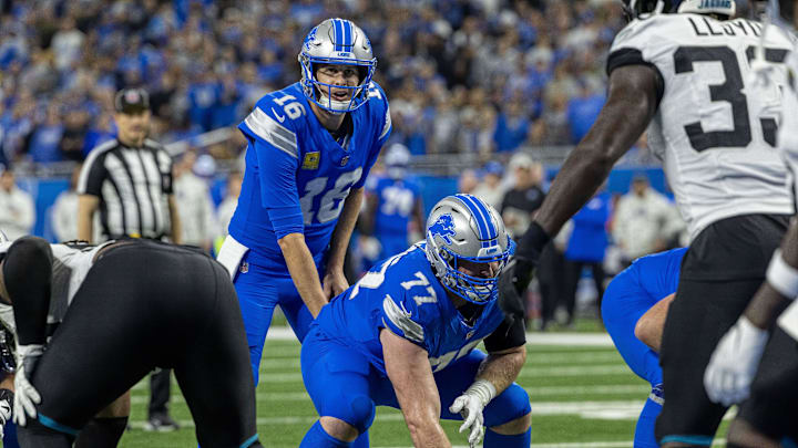 Detroit Lions quarterback Jared Goff (16) lines up for the snap behind center Frank Ragnow (77)
