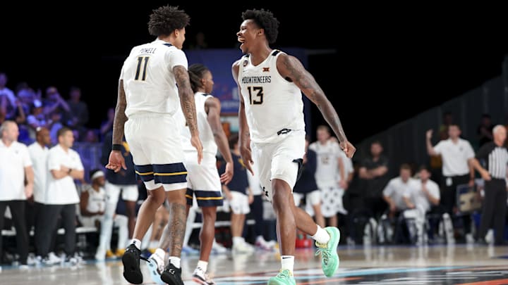 Nov 27, 2024; Paradise Island, Bahamas, BHS; West Virginia Mountaineers forward Amani Hansberry (13) celebrates with West Virginia Mountaineers guard Jonathan Powell (11) during overtime against the Gonzaga Bulldogs at the Atlantis Resort.  Mandatory Credit: Kevin Jairaj-Imagn Images