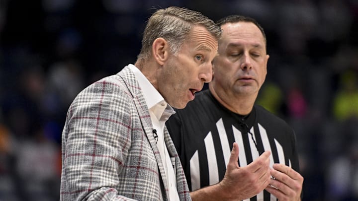 Mar 15, 2025; Nashville, TN, USA; Alabama Crimson Tide head coach Nate Oats talks with a referee against the Florida Gators during the second half at Bridgestone Arena. Mandatory Credit: Steve Roberts-Imagn Images Mar 15, 2025; Nashville, TN, USA; Alabama Crimson Tide head coach Nate Oats talks with a referee against the Florida Gators during the second half at Bridgestone Arena. Mandatory Credit: Steve Roberts-Imagn Images