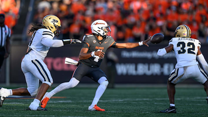 Sep 21, 2024; Corvallis, Oregon, USA; Oregon State Beavers quarterback Gevani McCoy (4) pitches the ball during the first half against the Purdue Boilermakers at Reser Stadium. Mandatory Credit: Craig Strobeck-Imagn Images Sep 21, 2024; Corvallis, Oregon, USA; Oregon State Beavers quarterback Gevani McCoy (4) pitches the ball during the first half against the Purdue Boilermakers at Reser Stadium. Mandatory Credit: Craig Strobeck-Imagn Images