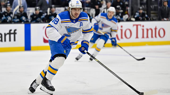 Jan 9, 2026; Salt Lake City, Utah, USA; St. Louis Blues center Robert Thomas (18) makes a quick pass during first period against the Utah Mammoth at Delta Center. Mandatory Credit: Peter Creveling-Imagn Images
