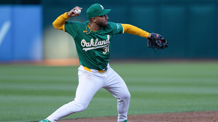 Aug 19, 2024; Oakland, California, USA; Oakland Athletics third baseman Abraham Toro (31) throws the ball during the third inning against the Tampa Bay Rays at Oakland-Alameda County Coliseum. Mandatory Credit: Stan Szeto-Imagn Images