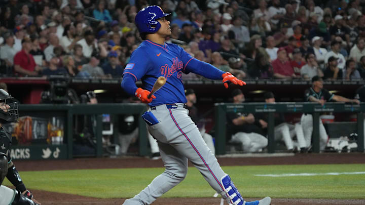 May 7, 2025; Phoenix, Arizona, USA; New York Mets outfielder Juan Soto (22) hits a solo home run against the Arizona Diamondbacks in the sixth inning at Chase Field. Mandatory Credit: Rick Scuteri-Imagn Images