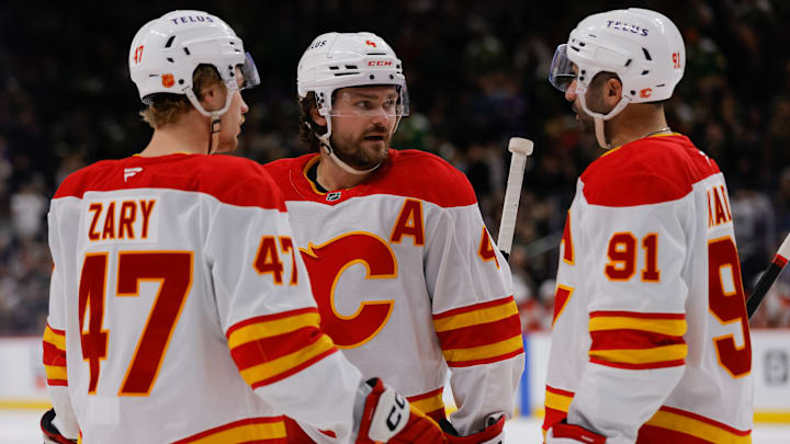 Calgary Flames players Connor Zary, Rasmus Andersson and Nazem Kadri
