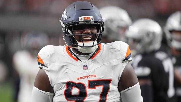 Dec 7, 2025; Paradise, Nevada, USA;  Denver Broncos defensive tackle Malcolm Roach (97) reacts after a sack against the Las Vegas Raiders during the first half at Allegiant Stadium. 