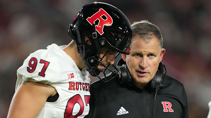 Oct 25, 2024; Los Angeles, California, USA; Rutgers Scarlet Knights head coach Greg Schiano talks with place kicker Riley McCann (97) in the first half at United Airlines Field at Los Angeles Memorial Coliseum. Mandatory Credit: Kirby Lee-Imagn Images Oct 25, 2024; Los Angeles, California, USA; Rutgers Scarlet Knights head coach Greg Schiano talks with place kicker Riley McCann (97) in the first half at United Airlines Field at Los Angeles Memorial Coliseum. Mandatory Credit: Kirby Lee-Imagn Images