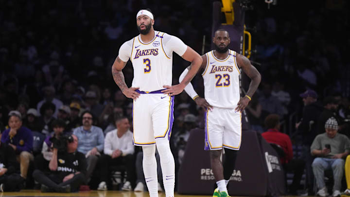 Dec 15, 2024; Los Angeles, California, USA; Los Angeles Lakers forward Anthony Davis (3) and forward LeBron James (23) react in the first half against the Memphis Grizzlies at Crypto.com Arena. Mandatory Credit: Kirby Lee-Imagn Images
