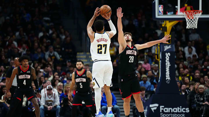 Dec 8, 2023; Denver, Colorado, USA; Denver Nuggets center Nikola Jokic (15) shoots over Houston Rockets center Alperen Sengun (28) in the first quarter at Ball Arena. Mandatory Credit: Ron Chenoy-Imagn Images