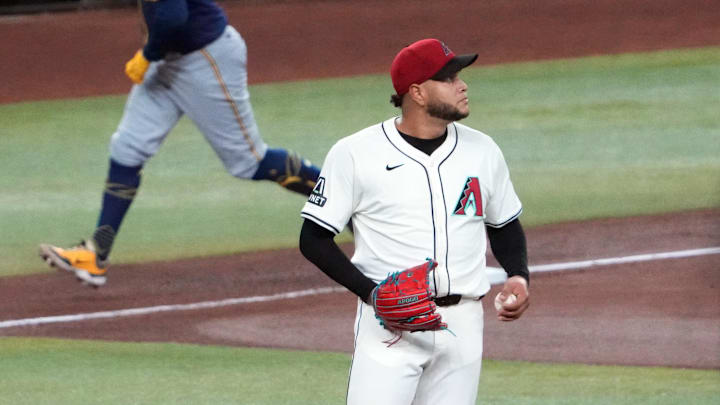 Sep 13, 2024; Phoenix, Arizona, USA; Arizona Diamondbacks pitcher Eduardo Rodriguez (57) reacts after allowing a two run home run to Milwaukee Brewers first base Rhys Hoskins (12) during the fourth inning at Chase Field. Mandatory Credit: Joe Camporeale-Imagn Images Sep 13, 2024; Phoenix, Arizona, USA; Arizona Diamondbacks pitcher Eduardo Rodriguez (57) reacts after allowing a two run home run to Milwaukee Brewers first base Rhys Hoskins (12) during the fourth inning at Chase Field. Mandatory Credit: Joe Camporeale-Imagn Images