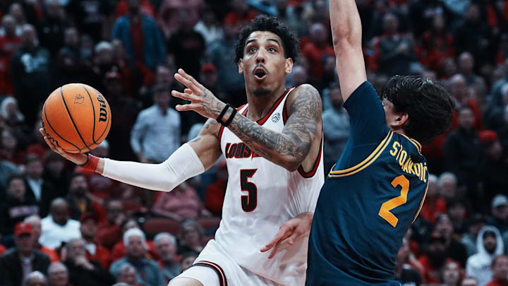 Louisville guard Terrence Edwards Jr. (5) shoots against California's Andrej Stojakovic (2) during their game at the KFC Yum! Center in Louisville, Ky. on Mar. 5, 2025. Louisville guard Terrence Edwards Jr. (5) shoots against California's Andrej Stojakovic (2) during their game at the KFC Yum! Center in Louisville, Ky. on Mar. 5, 2025.