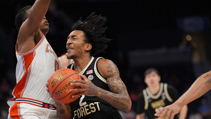 Mar 11, 2026; Charlotte, NC, USA; Wake Forest Demon Deacons forward Juke Harris (2) collides with Clemson Tigers forward RJ Godfrey (0) during the second half at Spectrum Center. Mandatory Credit: Jim Dedmon-Imagn Images