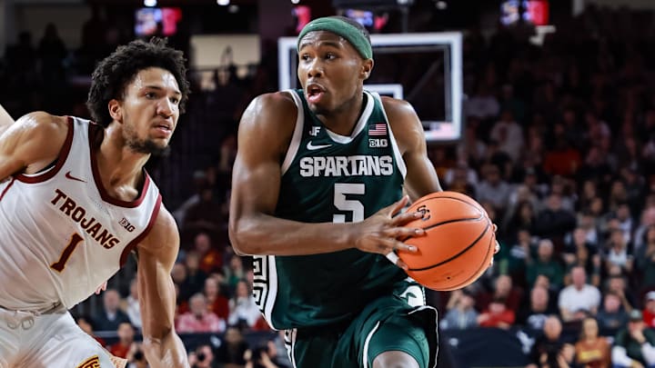 Feb 1, 2025; Los Angeles, California, USA;  Michigan State Spartans guard Tre Holloman (5) dribbles down the sideline against the USC Trojans at Galen Center. Mandatory Credit: William Navarro-Imagn Images