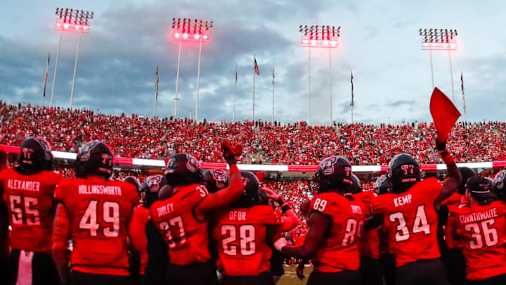 Sep 27, 2025; Raleigh, North Carolina, USA; North Carolina State Wolfpack bench celebrates before the first half of the game against Virginia Tech Hokies at Carter-Finley Stadium. Mandatory Credit: Jaylynn Nash-Imagn Images
