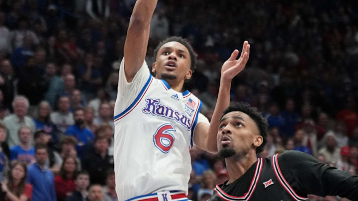 Jan 25, 2025; Lawrence, Kansas, USA; Kansas Jayhawks guard Rylan Griffen (6) shoots as Houston Cougars guard Mylik Wilson (8) defends in overtime at Allen Fieldhouse. Mandatory Credit: Denny Medley-Imagn Images Jan 25, 2025; Lawrence, Kansas, USA; Kansas Jayhawks guard Rylan Griffen (6) shoots as Houston Cougars guard Mylik Wilson (8) defends in overtime at Allen Fieldhouse. Mandatory Credit: Denny Medley-Imagn Images