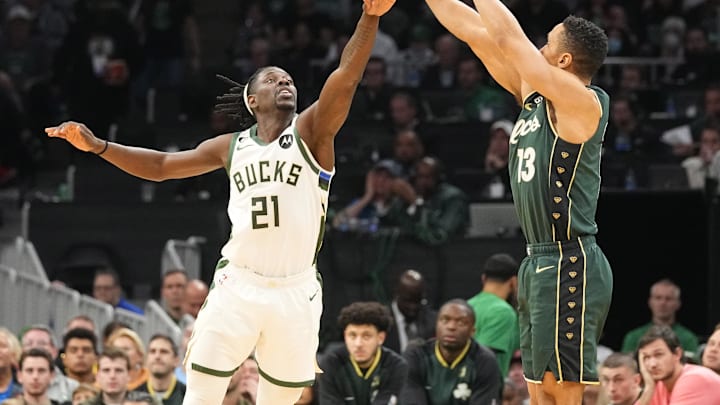 Dec 25, 2022; Boston, Massachusetts, USA; Boston Celtics point guard Malcolm Brogdon (13) shoots a three point jump shot against Milwaukee Bucks point guard Jrue Holiday (21) during the second half at TD Garden. Mandatory Credit: Gregory Fisher-Imagn Images Dec 25, 2022; Boston, Massachusetts, USA; Boston Celtics point guard Malcolm Brogdon (13) shoots a three point jump shot against Milwaukee Bucks point guard Jrue Holiday (21) during the second half at TD Garden. Mandatory Credit: Gregory Fisher-Imagn Images
