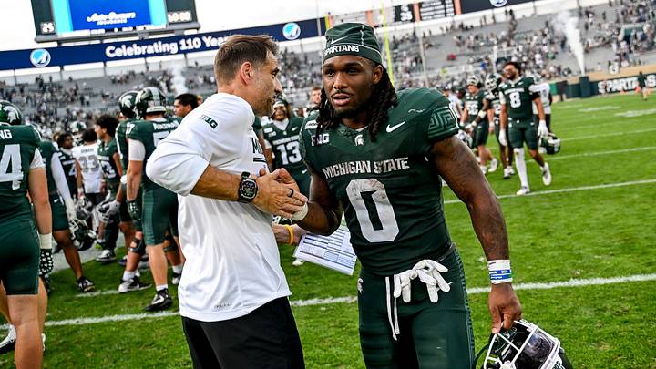 Michigan State’s Cam Edwards, right, shakes hands with defensive coordinator Joe Rossi after defeating Eastern Michigan on Saturday, Sept. 12, 2026, at Spartan Stadium in East Lansing. Michigan State’s Cam Edwards, right, shakes hands with defensive coordinator Joe Rossi after defeating Eastern Michigan on Saturday, Sept. 12, 2026, at Spartan Stadium in East Lansing.