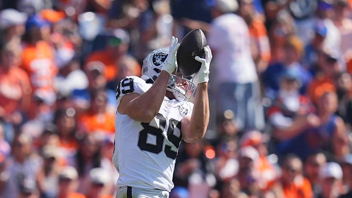Oct 6, 2024; Denver, Colorado, USA; Las Vegas Raiders tight end Brock Bowers (89) pulls a reception for a touchdown in the first quarter against the Denver Broncos at Empower Field at Mile High. Mandatory Credit: Ron Chenoy-Imagn Images