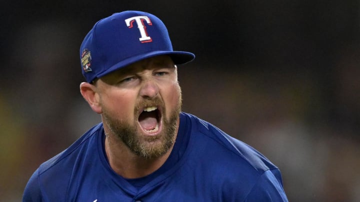 Jun 13, 2024; Los Angeles, California, USA;  Texas Rangers relief pitcher Kirby Yates (39) reacts after the final out of the ninth inning to earn a save against the Los Angeles Dodgers at Dodger Stadium. Mandatory Credit: Jayne Kamin-Oncea-USA TODAY Sports