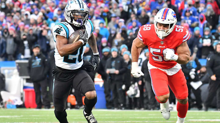 Dec 19, 2021; Orchard Park, New York, USA; Carolina Panthers running back Ameer Abdullah (20) outruns Buffalo Bills outside linebacker Matt Milano (58) to score a touchdown in the fourth quarter at Highmark Stadium. 