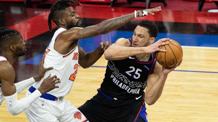 Mar 16, 2021; Philadelphia, Pennsylvania, USA; Philadelphia 76ers guard Ben Simmons (25) controls the ball against New York Knicks forward Reggie Bullock (25) during the second quarter at Wells Fargo Center. Mandatory Credit: Bill Streicher-Imagn Images