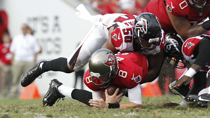 Nov 17, 2013; Tampa, FL, USA; Atlanta Falcons defensive end Osi Umenyiora (50) sacks Tampa Bay Buccaneers quarterback Mike Glennon (8) during the second half at Raymond James Stadium. Tampa Bay Buccaneers defeated the Atlanta Falcons 41-28. Mandatory Credit: Kim Klement-Imagn Images