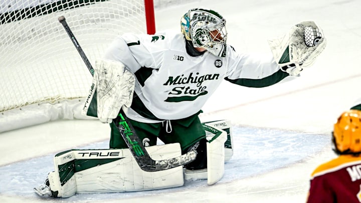 Michigan State's Trey Augustine catches a Minnesota shot during the first period on Friday, Jan. 23, 2026, at Munn Ice Arena in East Lansing. Michigan State's Trey Augustine catches a Minnesota shot during the first period on Friday, Jan. 23, 2026, at Munn Ice Arena in East Lansing.