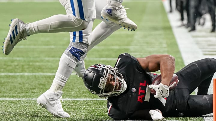 Dec 24, 2023; Atlanta, Georgia, USA; Atlanta Falcons running back Bijan Robinson (7) is tackled just short of the goal line against the Indianapolis Colts during the second half at Mercedes-Benz Stadium. Mandatory Credit: Dale Zanine-USA TODAY Sports