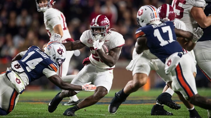 Alabama Crimson Tide running back Jam Miller (26) runs the ball as Auburn Tigers take on Alabama Crimson Tide in the Iron Bowl at Jordan-Hare Stadium in Auburn, Ala. on Saturday, Nov. 29, 2025. Alabama Crimson Tide running back Jam Miller (26) runs the ball as Auburn Tigers take on Alabama Crimson Tide in the Iron Bowl at Jordan-Hare Stadium in Auburn, Ala. on Saturday, Nov. 29, 2025.