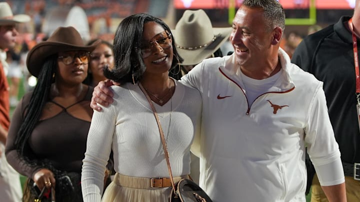 Nov 23, 2024; Austin, Texas, USA; Texas Longhorns head coach Steve Sarkisian and his wife Loreal Sarkisian walk off the field after defeating the Kentucky Wildcats at Darrell K Royal Texas Memorial Stadium.