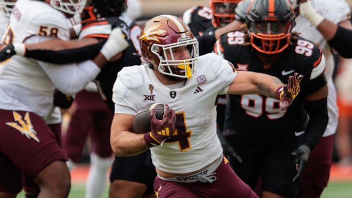 Nov 2, 2024; Stillwater, Oklahoma, USA; Arizona State Sun Devils running back Cam Skattebo (4) runs the ball during the first quarter against the Oklahoma State Cowboys at Boone Pickens Stadium. Mandatory Credit: William Purnell-Imagn Images