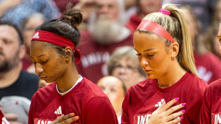Indiana's Chloe Moore-McNeil (22) and Syndey Parrish (33) during the National Anthem before the Indiana versus Maryland women's basketball game at Simon Skjodt Assembly Hall on Thursday, Feb. 27, 2025. Indiana's Chloe Moore-McNeil (22) and Syndey Parrish (33) during the National Anthem before the Indiana versus Maryland women's basketball game at Simon Skjodt Assembly Hall on Thursday, Feb. 27, 2025.