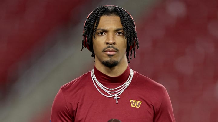 Jan 12, 2025; Tampa, Florida, USA; Washington Commanders quarterback Jayden Daniels (5) warms up before a NFC wild card playoff against the Tampa Bay Buccaneers at Raymond James Stadium. Mandatory Credit: Nathan Ray Seebeck-Imagn Images Jan 12, 2025; Tampa, Florida, USA; Washington Commanders quarterback Jayden Daniels (5) warms up before a NFC wild card playoff against the Tampa Bay Buccaneers at Raymond James Stadium. Mandatory Credit: Nathan Ray Seebeck-Imagn Images