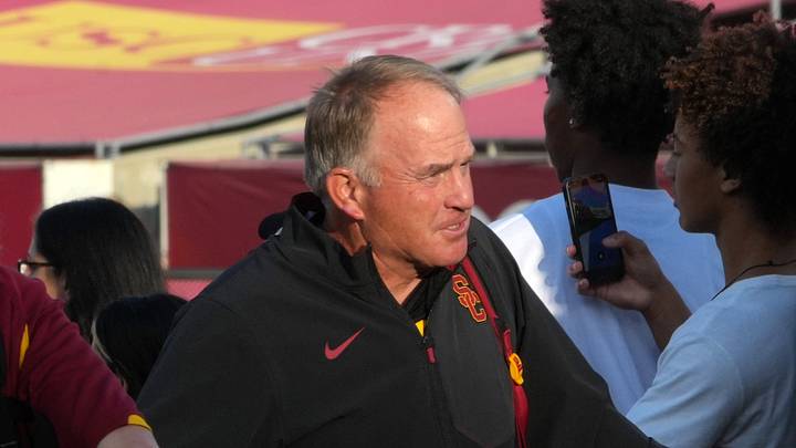 Sep 12, 2026; Los Angeles, California, USA; Southern California Trojans defensive coordinator Gary Patterson greets fans before the game against the Louisiana Ragin' Cajuns at United Airlines Field at Los Angeles Memorial Coliseum.