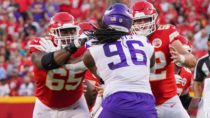 Aug 27, 2021; Kansas City, Missouri, USA; Kansas City Chiefs offensive guard Trey Smith (65) and center Creed Humphrey (52) block Minnesota Vikings defensive tackle Armon Watts (96) during the game at GEHA Field at Arrowhead Stadium. Mandatory Credit: Denny Medley-Imagn Images