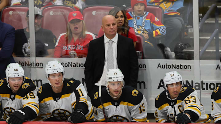 Oct 8, 2024; Sunrise, Florida, USA; Boston Bruins head coach Jim Montgomery looks on from the bench against the Florida Panthers during the third period at Amerant Bank Arena. Mandatory Credit: Sam Navarro-Imagn Images