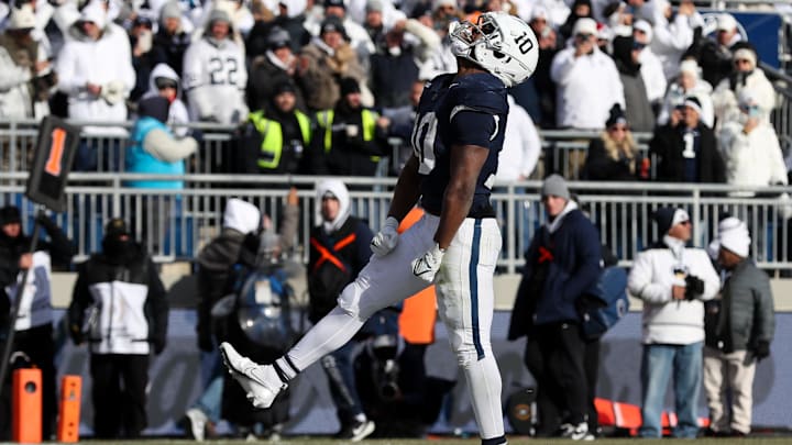 Penn State Nittany Lions running back Nicholas Singleton (10) celebrates after scoring a touchdown during the second quarter against the SMU Mustangs in the first round of the College Football Playoff at Beaver Stadium. 