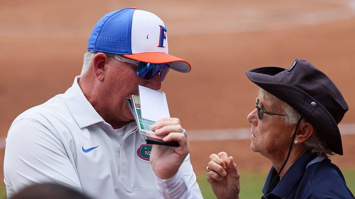 Florida head coach Tim Walton, left, talks with the NCAA site rep during game 3 of the super regional of the NCAA Division 1 softball championship at Katie Seashole Pressly Stadium in Gainesville, FL on Sunday, May 24, 2026. [Alan Youngblood/Gainesville Sun]