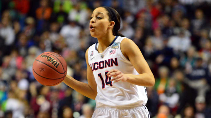 Apr 8, 2014; Nashville, TN, USA; Connecticut Huskies guard Bria Hartley (14) brings the ball up the court against the Notre Dame Fighting Irish during the first half of the championship game of the Final Four in the 2014 NCAA Womens Division I Championship tournament at Bridgestone Arena. Mandatory Credit: Don McPeak-Imagn Images