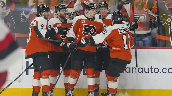May 9, 2026; Philadelphia, Pennsylvania, USA; Philadelphia Flyers left wing Alex Bump (20) celebrates a goal teammates against the Carolina Hurricanes in game four of the second round of the 2026 Stanely Cup Playoffs at Xfinity Mobile Arena.