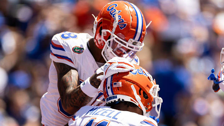 Florida Gators wide receiver Marcus Burke (88) celebrates with Florida Gators wide receiver Aidan Mizell (11) who scored a touchdown during the first half at the Orange and Blue spring football game at Steve Spurrier Field at Ben Hill Griffin Stadium in Gainesville, FL on Saturday, April 13, 2024. [Matt Pendleton/Gainesville Sun]