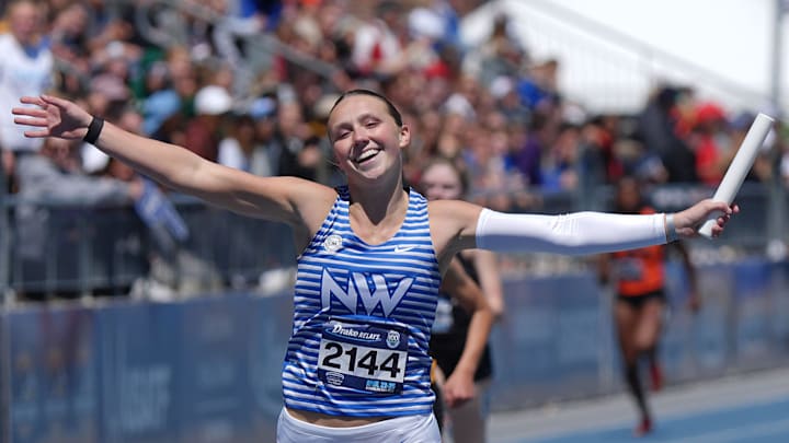Waukee Northwest’s anchor runner Katie Willits celebrates after winning high school girls 4x200-meter relay in the Drake Relays at drake Stadium on April 24, 2026, in Des Moines, Iowa.