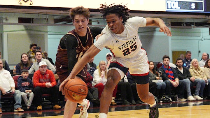 Stepinac's Jasiah Jervis (25) and Iona's Joe Wolf (11) battle for a loose ball during the Crusader Classic at the Westchester County Center in White Plains Jan. 4, 2025.
