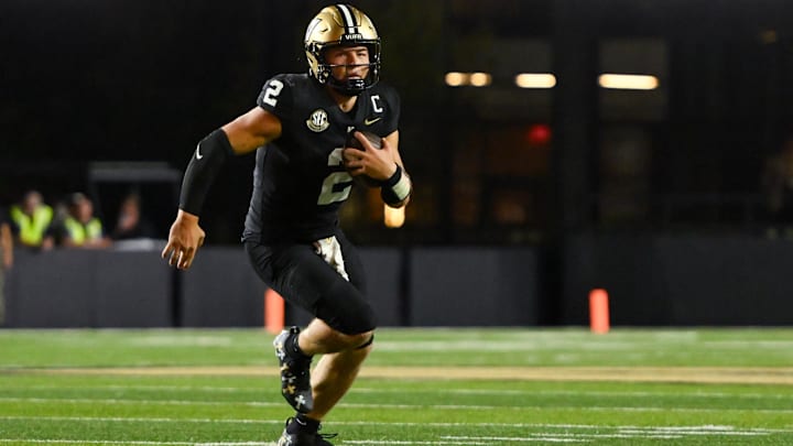 Aug 30, 2025; Nashville, Tennessee, USA;  Vanderbilt Commodores quarterback Diego Pavia (2) runs with the ball against the Charleston Southern Buccaneers during the second half at FirstBank Stadium. Mandatory Credit: Steve Roberts-Imagn Images