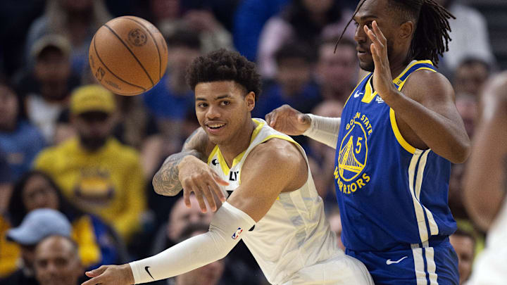 Jan 28, 2025; San Francisco, California, USA; Utah Jazz guard Keyonte George (3) passes away from defensive pressure by Golden State Warriors forward Kevon Looney (5) during the first quarter at Chase Center. Mandatory Credit: D. Ross Cameron-Imagn Images