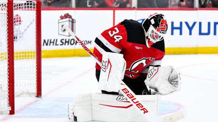 Dec 13, 2025; Newark, New Jersey, USA; New Jersey Devils goaltender Jake Allen (34) makes a save against the Anaheim Ducks during the first period at Prudential Center. Mandatory Credit: John Jones-Imagn Images
