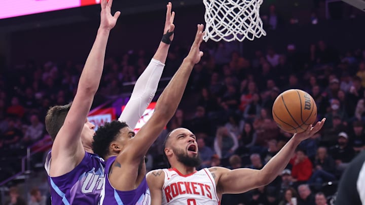 Feb 22, 2025; Salt Lake City, Utah, USA; Houston Rockets forward Dillon Brooks (9) goes to the basket against Utah Jazz center Walker Kessler (left) and forward KJ Martin (middle) during the second half at Delta Center. Mandatory Credit: Rob Gray-Imagn Images Feb 22, 2025; Salt Lake City, Utah, USA; Houston Rockets forward Dillon Brooks (9) goes to the basket against Utah Jazz center Walker Kessler (left) and forward KJ Martin (middle) during the second half at Delta Center. Mandatory Credit: Rob Gray-Imagn Images