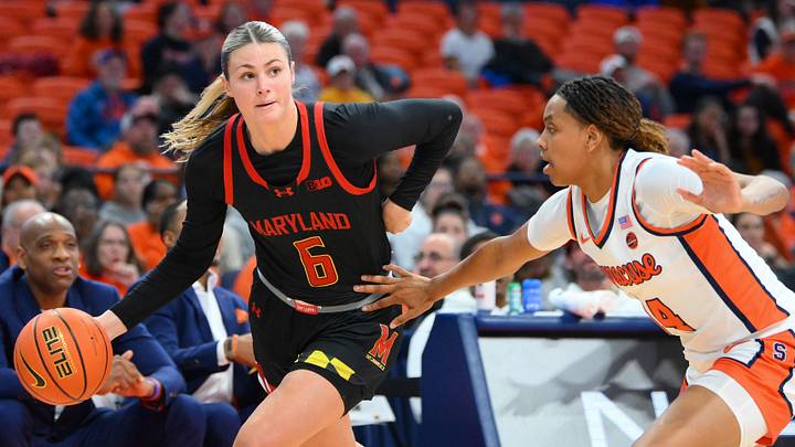 Nov 13, 2024; Syracuse, New York, USA; Maryland Terrapins guard Saylor Poffenbarger (6) drives against Syracuse Orange forward Shy Hawkins (14) during the first half at the JMA Wireless Dome. Mandatory Credit: Rich Barnes-Imagn Images Nov 13, 2024; Syracuse, New York, USA; Maryland Terrapins guard Saylor Poffenbarger (6) drives against Syracuse Orange forward Shy Hawkins (14) during the first half at the JMA Wireless Dome. Mandatory Credit: Rich Barnes-Imagn Images