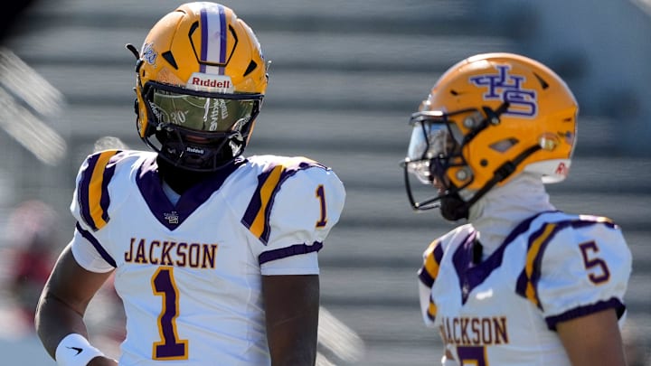 Dec 6, 2024; Birmingham, AL, USA; Jackson's Landon Duckworth (1) and Jackson's Chris Payne (5) talk during a timeout during the game with Cherokee County at Protective Stadium in the AHSAA 4A State Championship game.